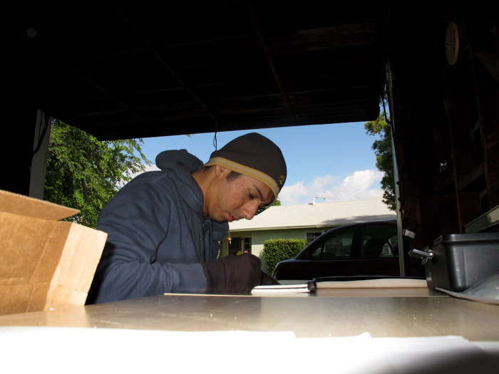 Henry Colchado sketching for a larger chalk drawing